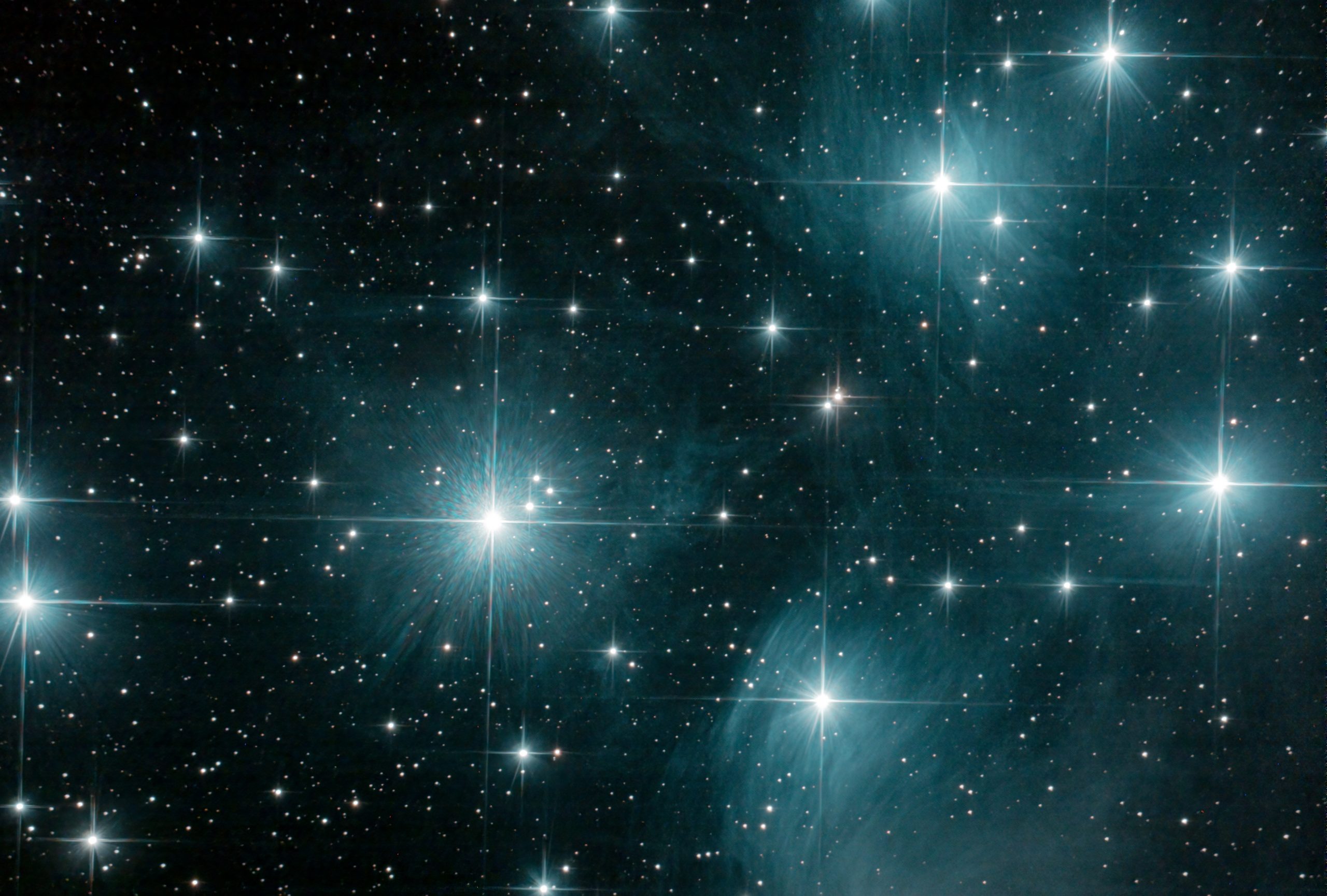 The Pleiades or M45 (part of) (Ian A Smith). Skywatcher 200p on NEQ6 mount, with guiding and dithering every 10 images. Optolong CLS-CCD filter, Baader MPCC M3. ASI294MC Pro at -20C. 67 x 60 second exposures (1 hour 7 minutes) at Gain 121, Offset 30 , 20 dark frames, 30 flat fields, 30 dark flat frames. Processed in APP, Topaz de-noise and Photoshop. The main stars are over exposed and it was a bit windy. 13th November 2020